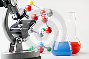 Microscope, Vials and Atoms