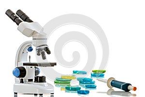 Microscope, on white background symol of research, laboratory, medicine and science