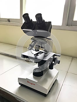 Microscope on the white desk