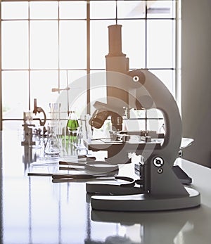 Microscopes and Lab glassware on the table in the lab Along with various accessories That is ready for use in research