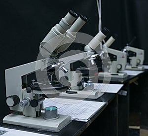 Microscopes set on the worktable of the laboratory