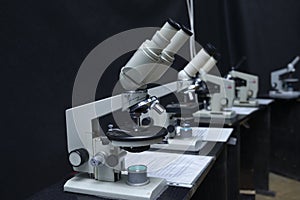Microscopes set on the worktable of the school lab
