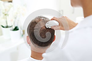 Microscopic analysis of the condition of hair and scalp.