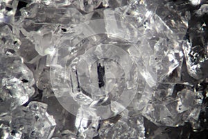 Microscopic sugar transparent crystals. Food background texture. Sweetness super macro close-up by microscope