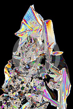 Microscopic view of potassium nitrate crystals in polarized light