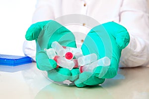 Microtubes with biological samples in the hand.