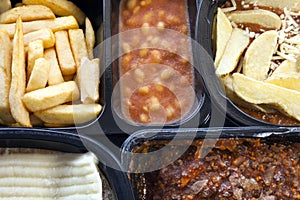 Microwavable ready to cook, frozen foods, in plastic boxes .