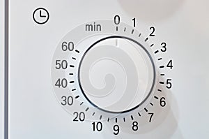 Microwave oven circular timer for one hour, analogue white