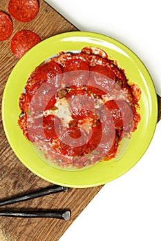 Microwaved Frozen Pizza on Table