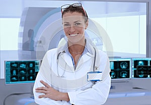 Mid-adult female doctor in MRI room at hospital