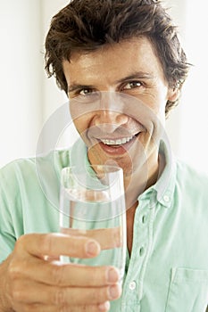 Mid Adult Man Drinking A Glass Of Water