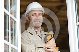 mid-adult man posing with drill