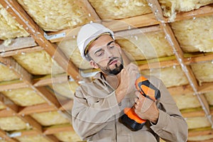 mid-adult man using drill