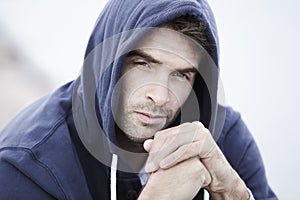 Mid adult man wearing hooded top