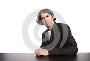 Mid-adult portrait seated at his desk