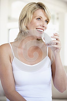 Mid Adult Woman Drinking A Glass Of Milk