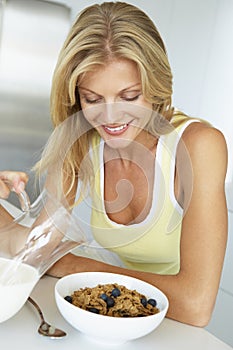 Mid Adult Woman Eating Healthy Breakfast