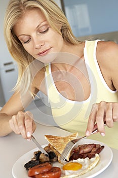 Mid Adult Woman Eating Unhealthy Breakfast