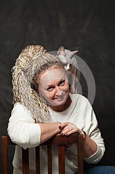 Mid adult woman and her pet cat portrait