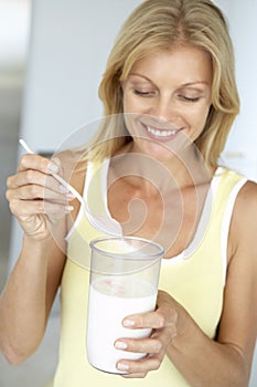 Mid Adult Woman Holding Dietary Supplements photo