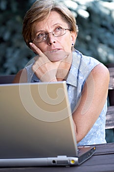 Mid adult woman with laptop