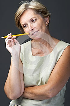 Mid adult woman with pencil