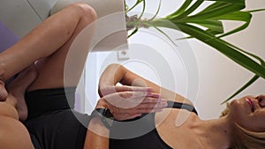 Mid adult woman sitting in lotus position