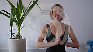 Mid adult woman sitting in lotus position