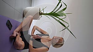 Mid adult woman sitting in lotus position