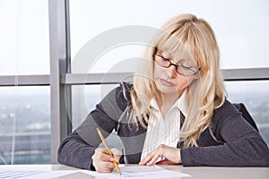 Mid adult woman work with documents