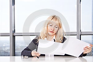 Mid adult woman work with documents