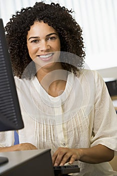 Mid adult woman working on a computer