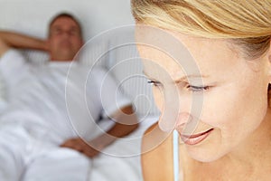 Mid age couple on bed