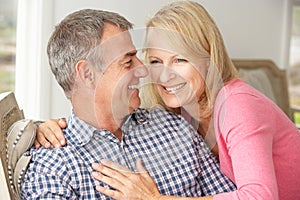 Mid age couple on sofa photo