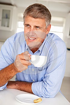Mid age man with coffee