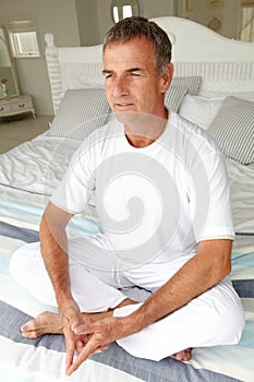 Mid age man in lotus position