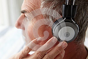 Mid age man wearing headphones