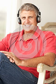 Mid age man wearing headphones