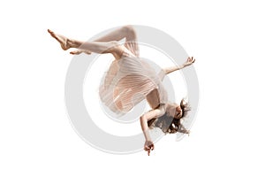 Mid-air beauty. Full length studio shot of attractive young woman hovering in air and keeping eyes closed photo