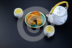 Mid-Autumn Festival moon cake dish with hot tea pot and cups