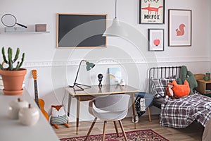 Mid century furniture in genderless white bedroom for kid photo