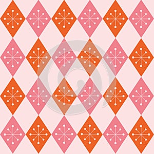 Mid century modern starbursts seamless pattern on pink and orange retro harlequin diamonds.
