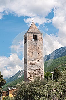 Mid-evil stone, observation tower, against a blue sky with white clouds in Tuscany, Italy