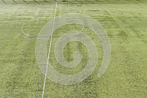 Mid-field line on green soccer field