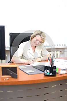 Mid-life business woman write document