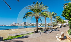 Mid morning sun on the city. Warm sunny day along the beach in Ibiza, St Antoni de Portmany Balearic Islands, Spain