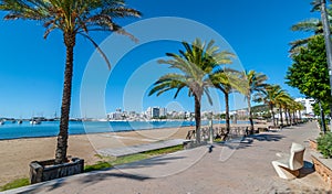 Mid morning sun on the city. Warm sunny day along the beach in Ibiza, St Antoni de Portmany Balearic Islands, Spain