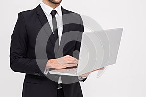 Mid section of a businessman using laptop