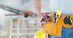 Mid section of construction man with tools