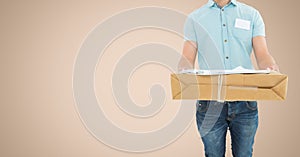 Mid section of delivery man holding parcel box